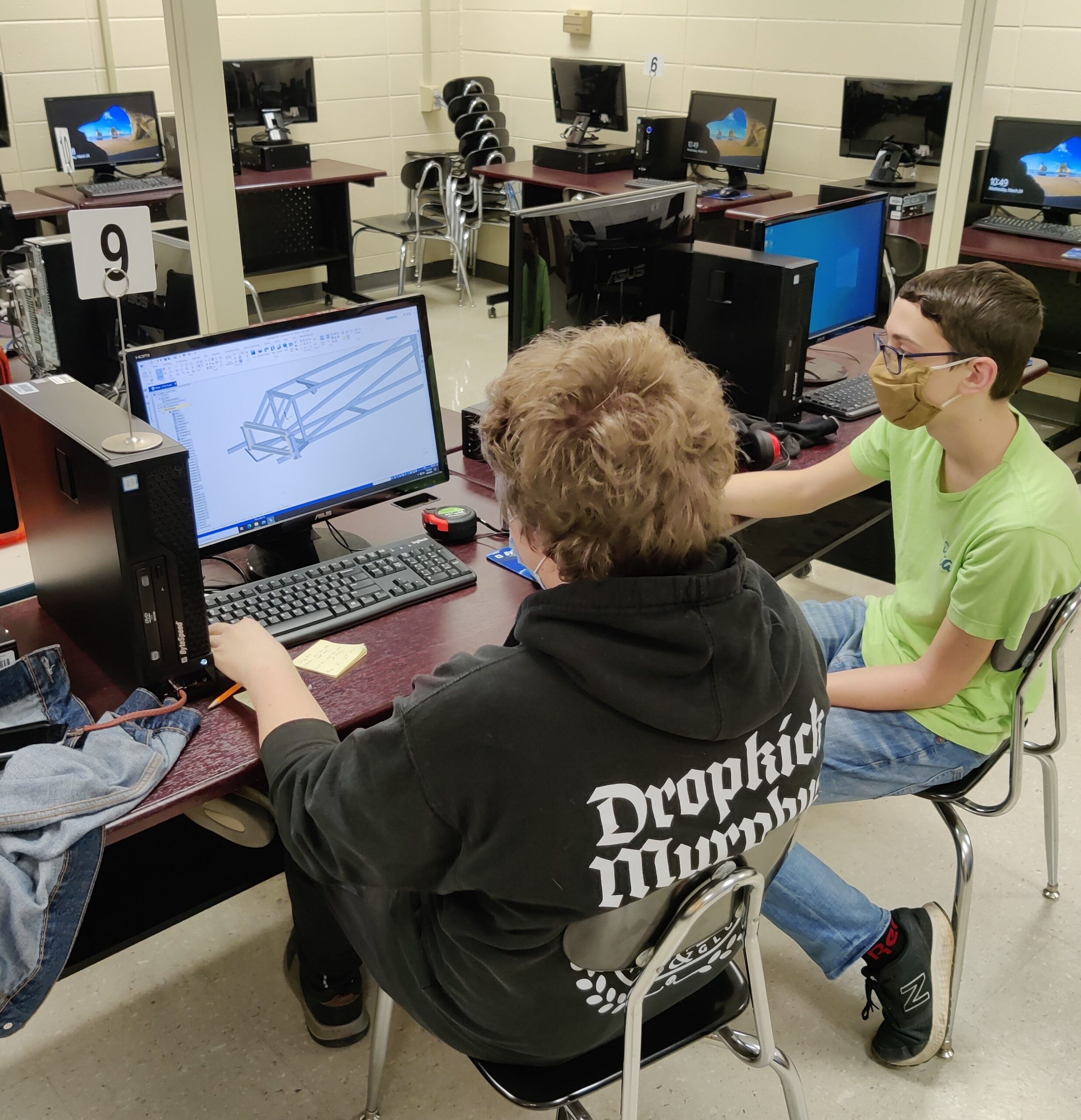 Student using CAD software to design robot parts